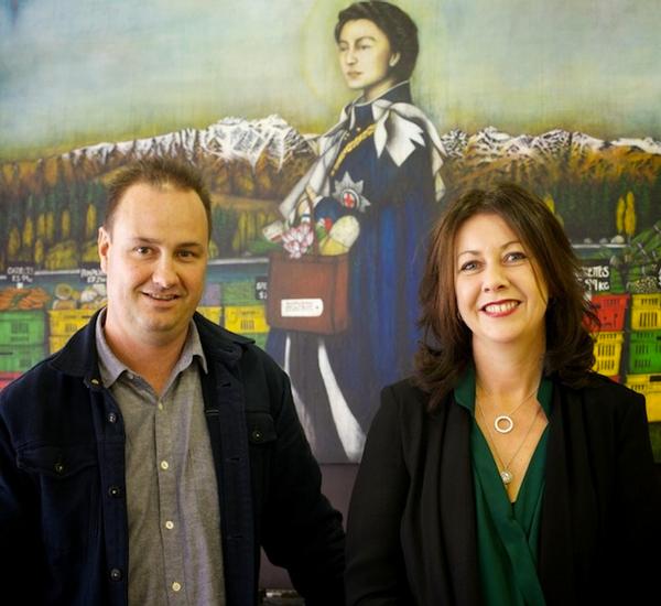 Mediterranean Market owners Nathan and Angela Imlach with the infamous in-store Queen painting.
